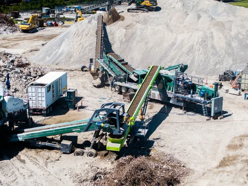 A loader working alongside a haul truck